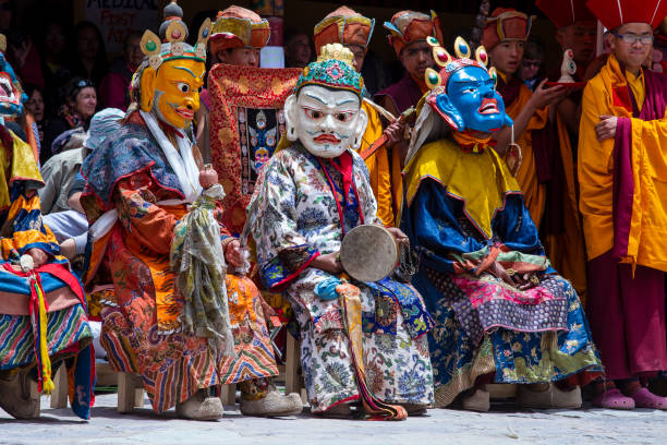 Tibetan man, dressed in a mystical mask, perform a dance during the Buddhist festival in Hemis monastery, Ladakh, India Ladakh, Northern India - june 26, 2015 : Tibetan man, dressed in a mystical mask, perform a dance during the Buddhist festival in Hemis monastery, near Leh, Ladakh, North India lamayuru stock pictures, royalty-free photos & images