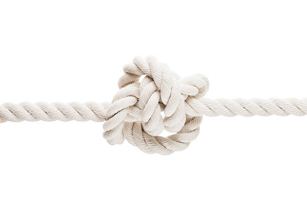 Tied knot on rope or spring stock photo