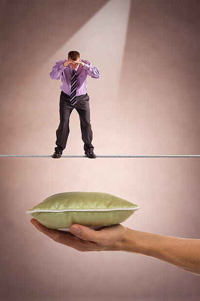 Tightrope over pillow of Safety stock photo