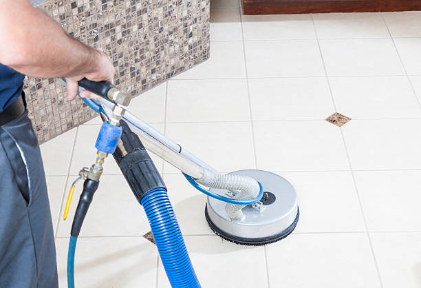 Tile and Grout Cleaning Man cleaning tile and grout with machine in bathroom tile stock pictures, royalty-free photos & images