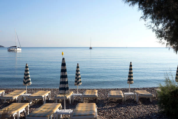 Tilos island - Livadi village calm sea and empty beach on a summer morning,  Aegean sea, Dodecanese Islands, Greece stock photo