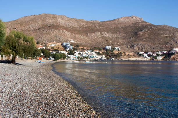 Tilos island - Livadi village, the long pebble beach on a sunny morning,  Aegean sea, Dodecanese Islands, Greece stock photo