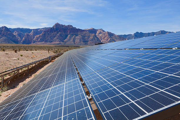 Tilted solar panels, near the mountains of the Mojave Desert stock photo