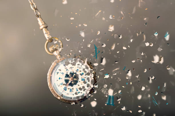 time concept: bursting pocket watch flying time: one retro pocket watch breaking into particles wasting time stock pictures, royalty-free photos & images