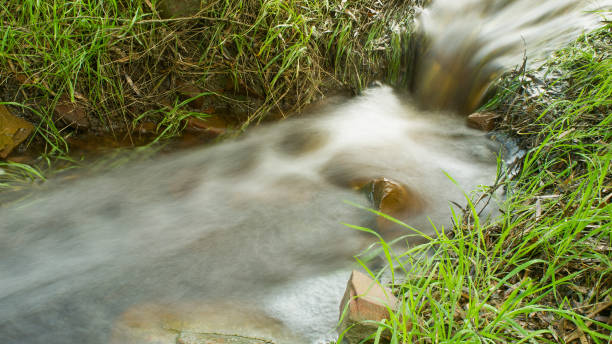 Time exposure of fast flowing water stock photo
