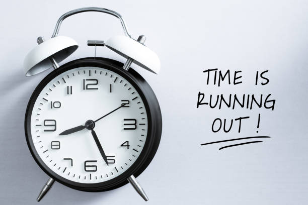Time is Running Out Concept Time is Running Out Concept with alarm clock aside. deadline stock pictures, royalty-free photos & images