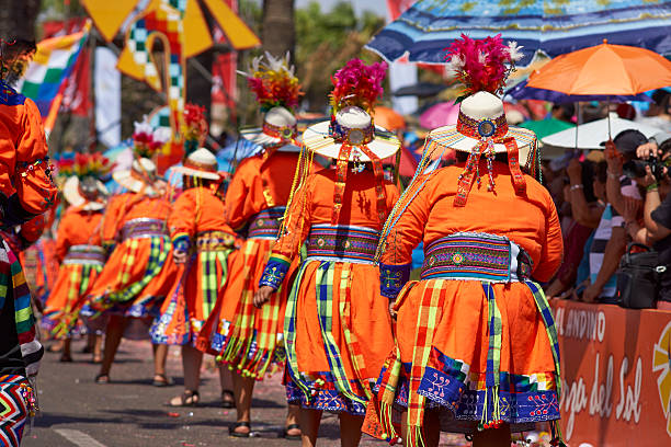 Tinku Dance Group Arica, Сhile - January 24, 2016: Colourfully dressed Tinku dance group performing as part of the annual Carnaval Andino con la Fuerza del Sol in Arica, Chile. The Tinku dance originates in Bolivia and is a ritualised fight. hot peruvian women stock pictures, royalty-free photos & images