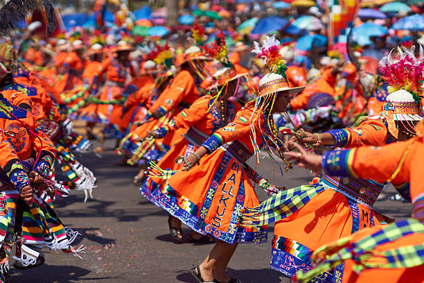 Tinku Dance Group Arica, Сhile - January 24, 2016: Colourfully dressed Tinku dance group performing as part of the annual Carnaval Andino con la Fuerza del Sol in Arica, Chile. The Tinku dance originates in Bolivia and is a ritualised fight. hot peruvian women stock pictures, royalty-free photos & images