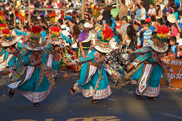 Tinku Dance Group Arica, Сhile - January 22, 2016: Colourfully dressed Tinku dance group performing as part of the annual Carnaval Andino con la Fuerza del Sol in Arica, Chile. The Tinku dance originates in Bolivia and is a ritualised fight. hot peruvian women stock pictures, royalty-free photos & images