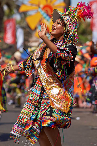 Tinku Dancer Arica, Сhile - January 24, 2016: Colourfully dressed Tinku dancer performing as part of the annual Carnaval Andino con la Fuerza del Sol in Arica, Chile. The Tinku dance originates in Bolivia and is a ritualised fight. hot peruvian women stock pictures, royalty-free photos & images