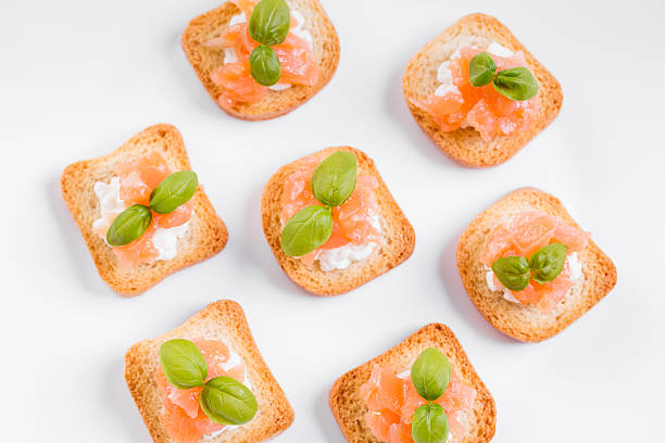 Tiny sandwiches with smoked salmon and cream cheese. stock photo
