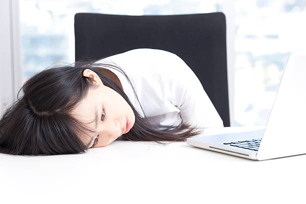 Tired Japanese business woman stock photo