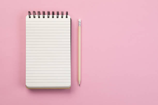 To do list - Concept Spiral notebook and pencil on pink background to do list stock pictures, royalty-free photos & images