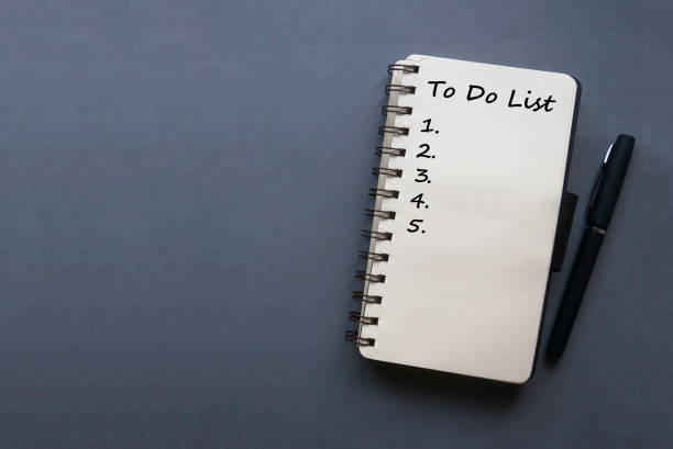 To Do List Top view of pen and notebook written with To Do List and its numbering on grey background with copy space. to do list stock pictures, royalty-free photos & images