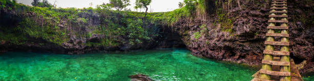 To Sua ocean trench - famous swimming hole, Upolu, Samoa, South Pacific To Sua ocean trench - famous swimming hole, Upolu, Samoa Island, South Pacific apia samoa stock pictures, royalty-free photos & images