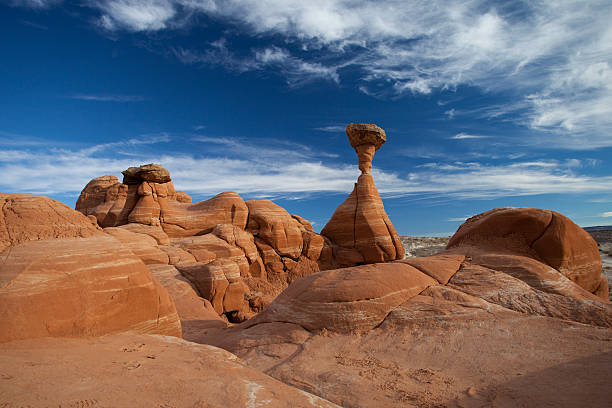 Toadstool Hoodoo, Utah, USA Toadstool Hoodoo located between Kanab, UT and Page, AZ. Photo was taken in October 2012 in the late afternoon. Combination of incredible sandstone formation with an amazing sky. entrada sandstone stock pictures, royalty-free photos & images