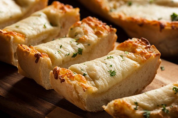 Toasted Cheese and Garlic Bread Toasted Cheese and Garlic Bread with Parsley garlic bread stock pictures, royalty-free photos & images