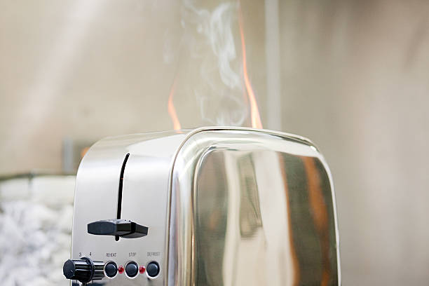 toaster on fire - smoke alarm stockfoto's en -beelden