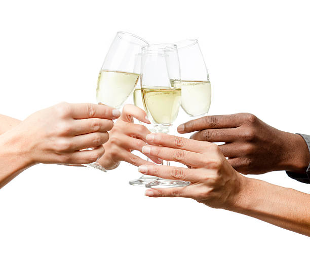 Toasting, three women and a man hands stock photo