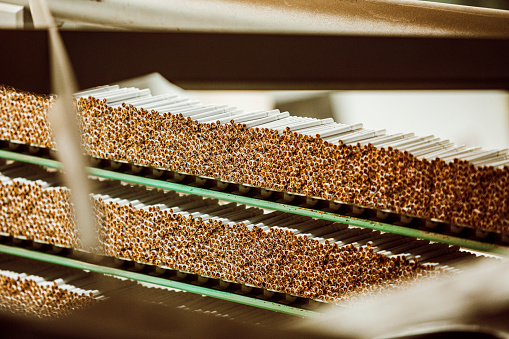 Close up of cigarettes in factory