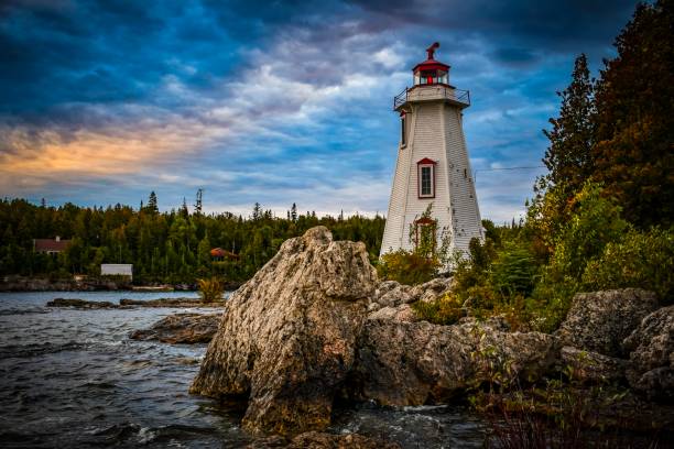 Tobermory Lighthouse Lighthouse in Tobermory, Ontario, Canada at sunset during fall. bruce peninsula national park stock pictures, royalty-free photos & images