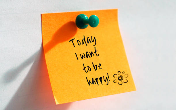 Today I want to be happy written on a orange post it stock photo