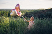 istock Toddler with heart-shaped balloons 646169844