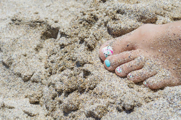 Toes in the sand stock photo