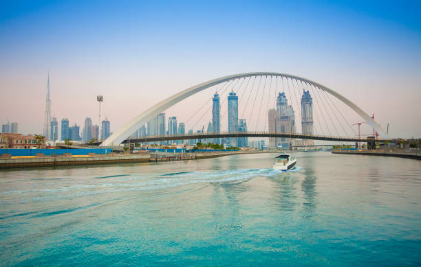 Tolerance bridge and boat in Dubai city stock photo