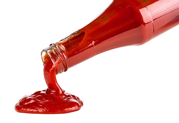 tomato ketchup ketchup pouring out of bottle ketchup stock pictures, royalty-free photos & images