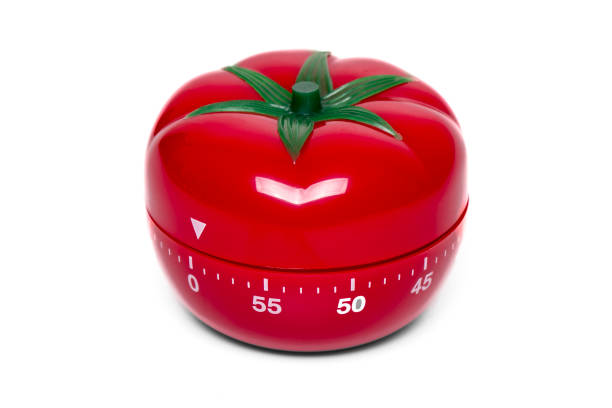 tomato kitchen clock timer stock photo