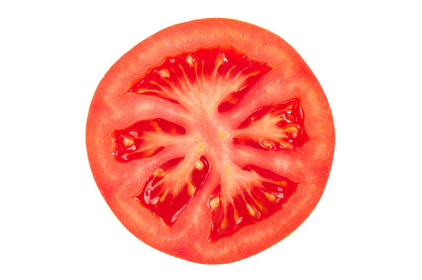 Tomato slice Fresh and ripe juicy tomato slice on white background slice of food stock pictures, royalty-free photos & images