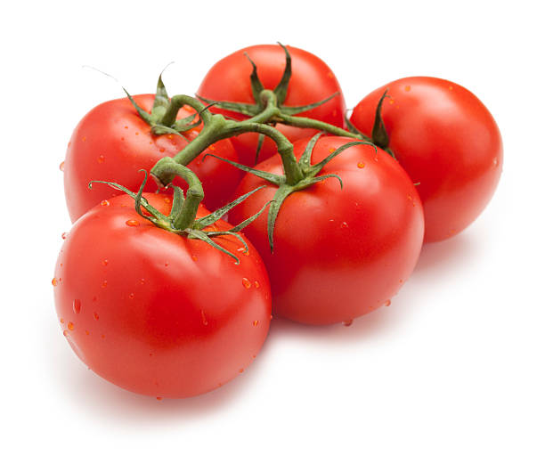 Tomatoes on the vine Cluster of tomatoes on the vine ripe stock pictures, royalty-free photos & images