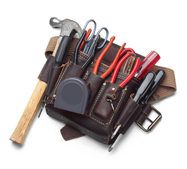 Tool belt full of tools isolated on white background Construction worker's tool belt on white with soft shadow.For version with hard hat see file# 2606840 tool belt stock pictures, royalty-free photos & images