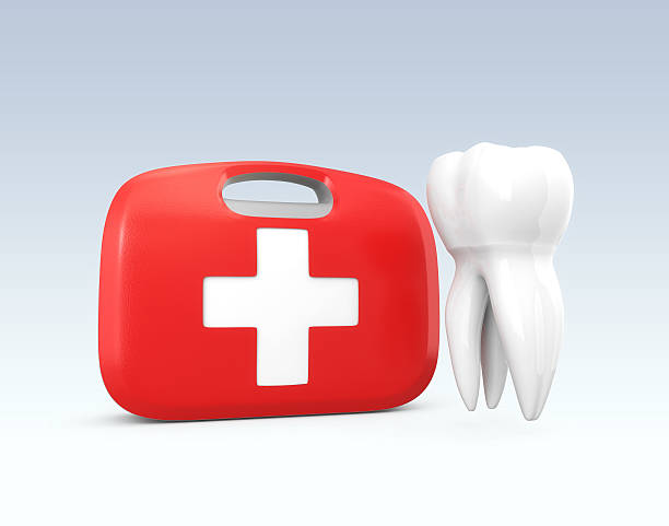 Tooth and first aid kit stock photo
