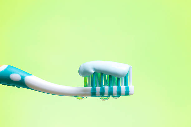 Toothbrush on green stock photo