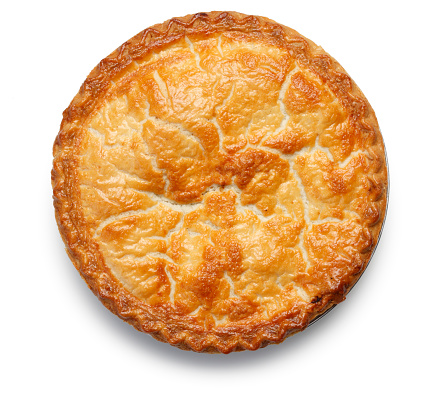 A top view of an apple pie on a white background.  The flaky, golden crust invites the viewer to reminisce.  There is a soft shadow created by soft directional light.