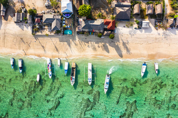 Top down view of Nusa Lembongan beach with traditional boat anchored in Bali, Indonesia stock photo