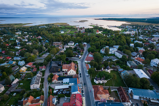 Top drone view of a city by Baltic sea.