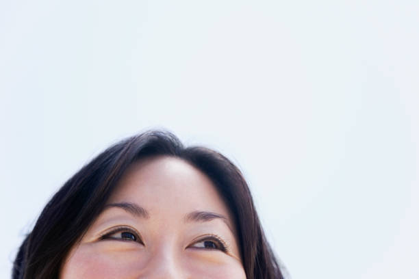 Top of Asian woman's face Top of Asian woman's face high section stock pictures, royalty-free photos & images
