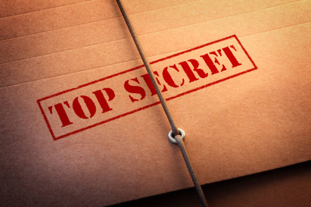 Top Secret File A close up of "Top Secret" stamped on a file folder. top secret stock pictures, royalty-free photos & images