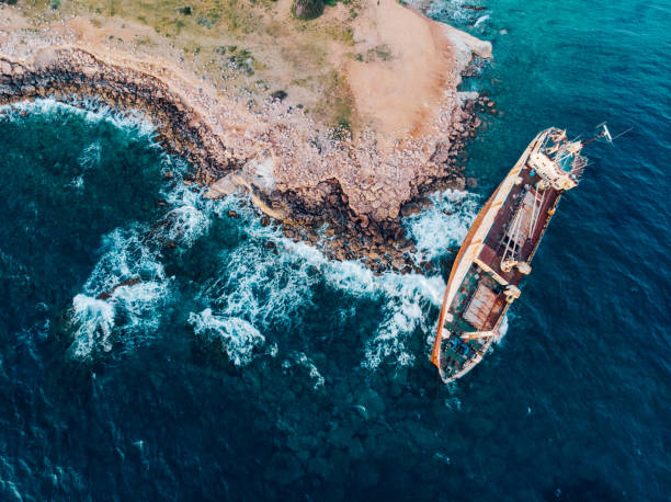Top view of a ship stranded near the shore. stock photo