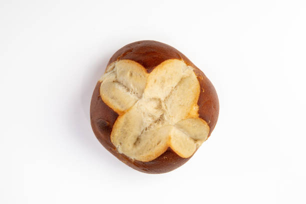 Top View of a Single Pretzel Roll on a White Table stock photo