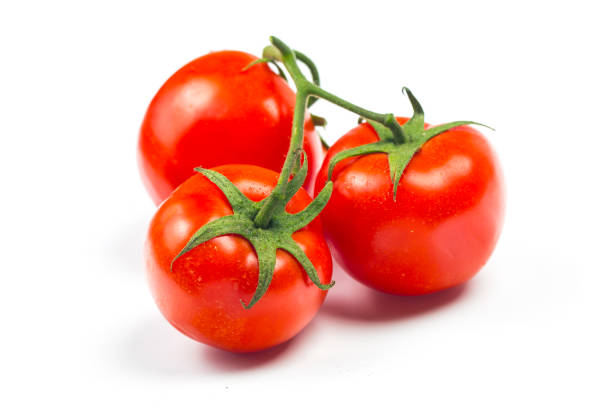 Top view of bunch of fresh tomatoes isolated on white background stock photo