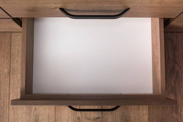 Top view of empty open wooden drawer. stock photo