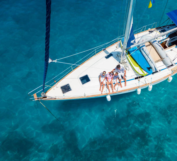 Top view of Family with adorable kids resting on yacht stock photo