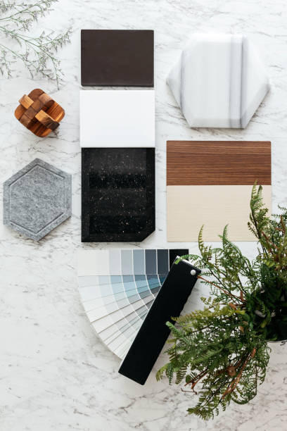 Top view of Material Selections including Granite tile, Marble tile, Acoustic tile, Walnut and Ash Wood Laminate and Painted color swatch with plant and flowers on marble top table. Top view of Material Selections including Granite tile, Marble tile, Acoustic tile, Walnut and Ash Wood Laminate and Painted color swatch with plant and flowers on marble top table. color swatch stock pictures, royalty-free photos & images