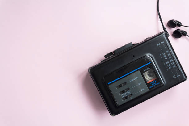 Top view of old walkman on pink background with copy space stock photo