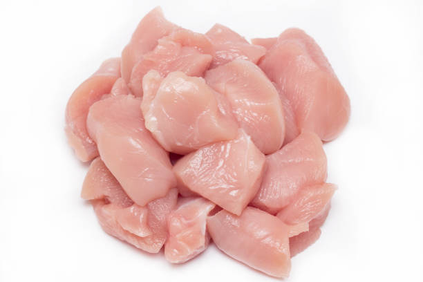 Top view of raw chicken fillet chunks isolated on white stock photo