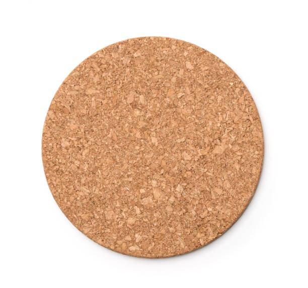 Top view of round  cork trivet Top view of round  cork trivet isolated on white coaster stock pictures, royalty-free photos & images